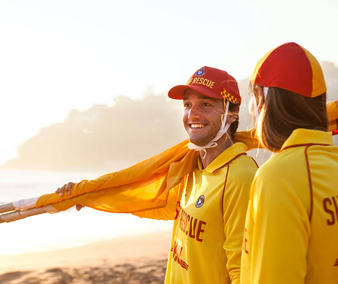 Lifesavers carrying flags